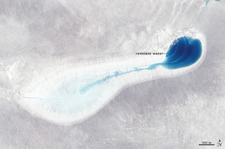 Illustration for article titled Melt Ponds on Ice Sheets Are Chillingly Beautiful